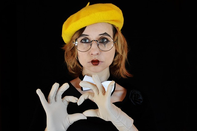 person using open hand gestures while explaining something to a small group in a casual setting